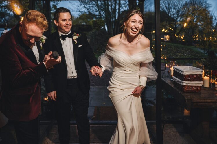 bride and groom entering the vinehouse at Dewsall Court