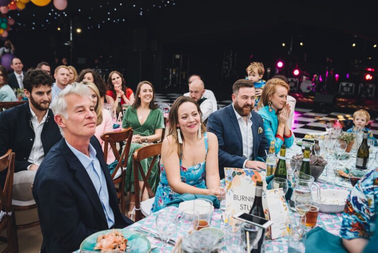 luxury marquee wedding guests during speeches