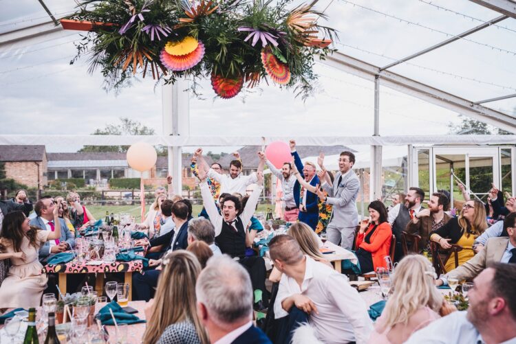 luxury marquee wedding guests during speeches