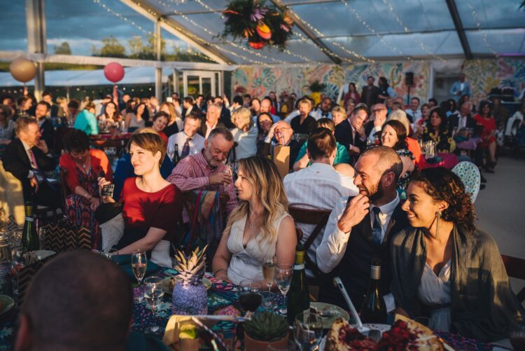 luxury marquee wedding guests during speeches