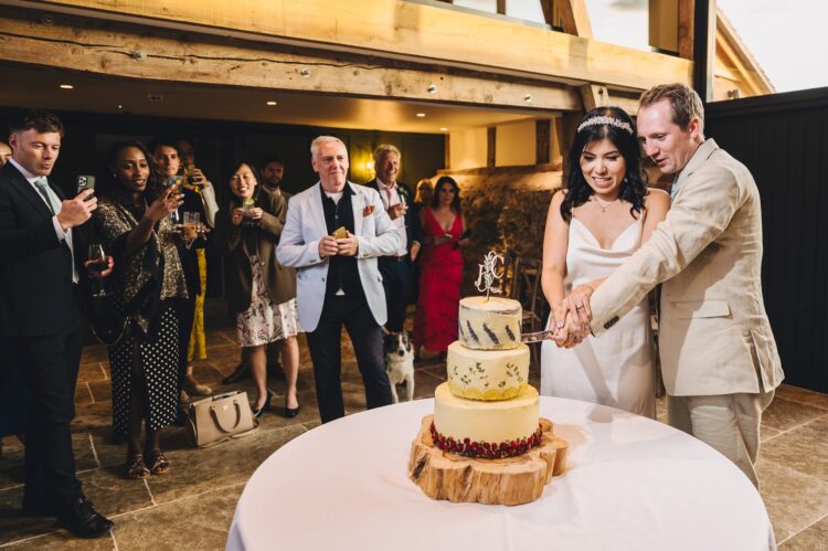 cake cutting at Shucknall Court, Herefordshire luxury wedding venue