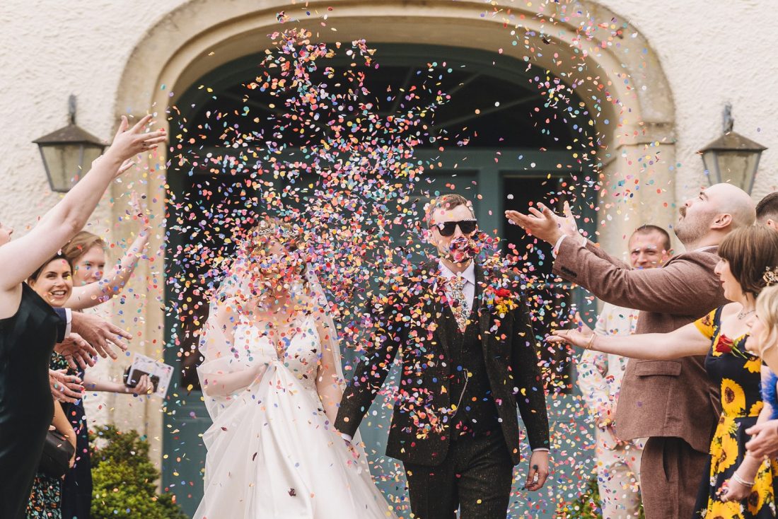 bride and groom enjoying the confetti moment at matara centre captured by Marta May wedding photographer