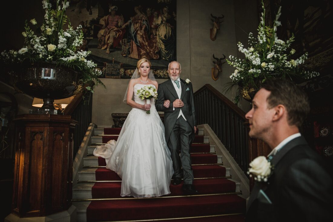 bride walking down the steps at Eastnor Castle, Eastnor Castle wedding photographer